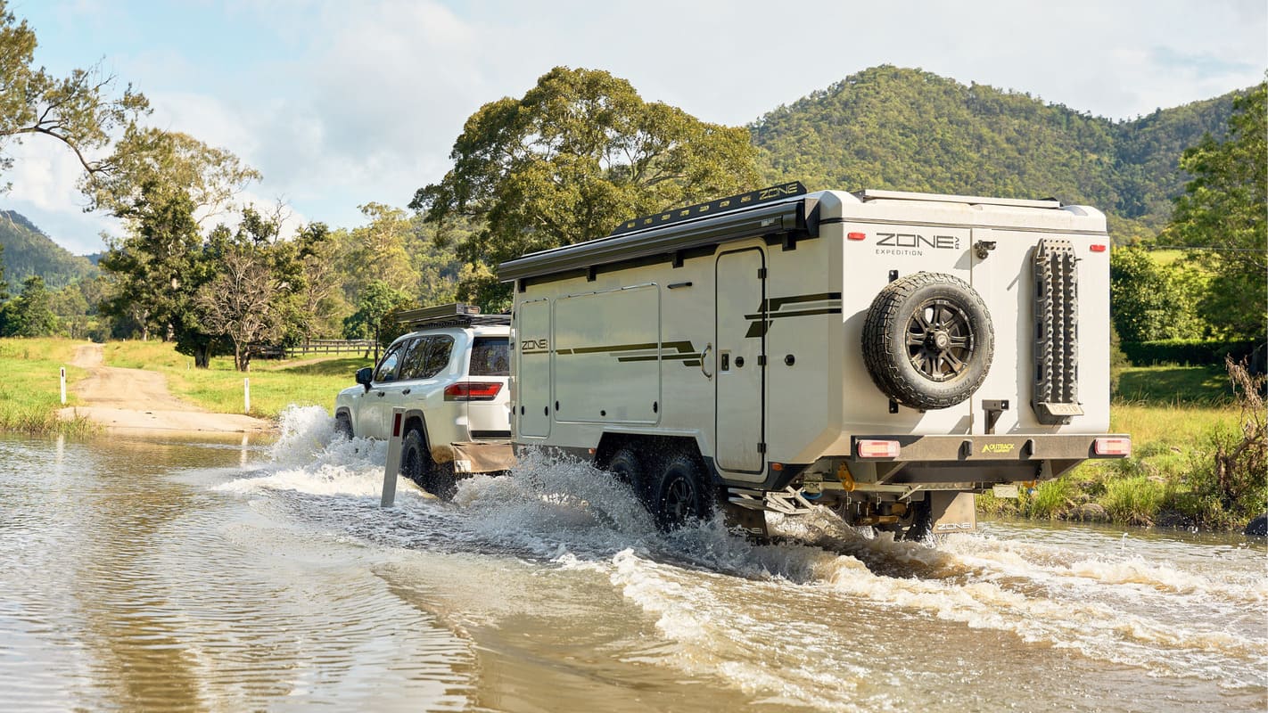 caravan towed through water